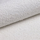Modulares Ecksofa Yuma mit Beistellhocker aus Bouclé