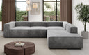 Designer Ecksofa Lesley mit langer Ottomane in Samt